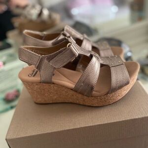 Very gently worn Clark’s brand, metallic bronze, colored wedge sandals